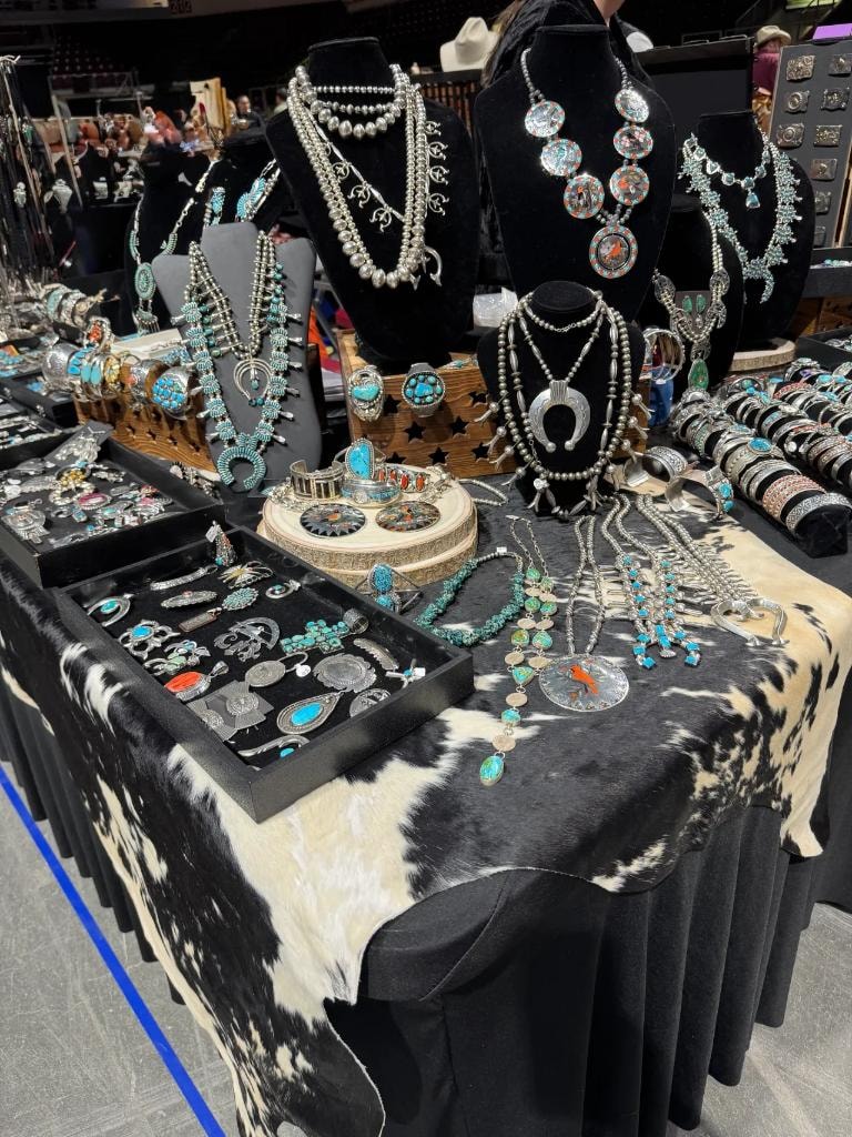 Turquoise and silver jewelry display at vendor booth