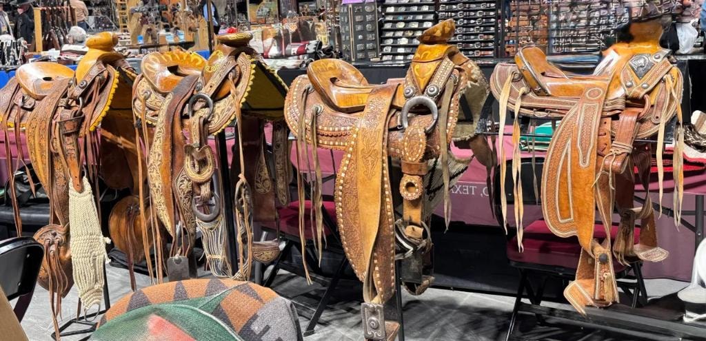 Ornate western saddles on display at the show