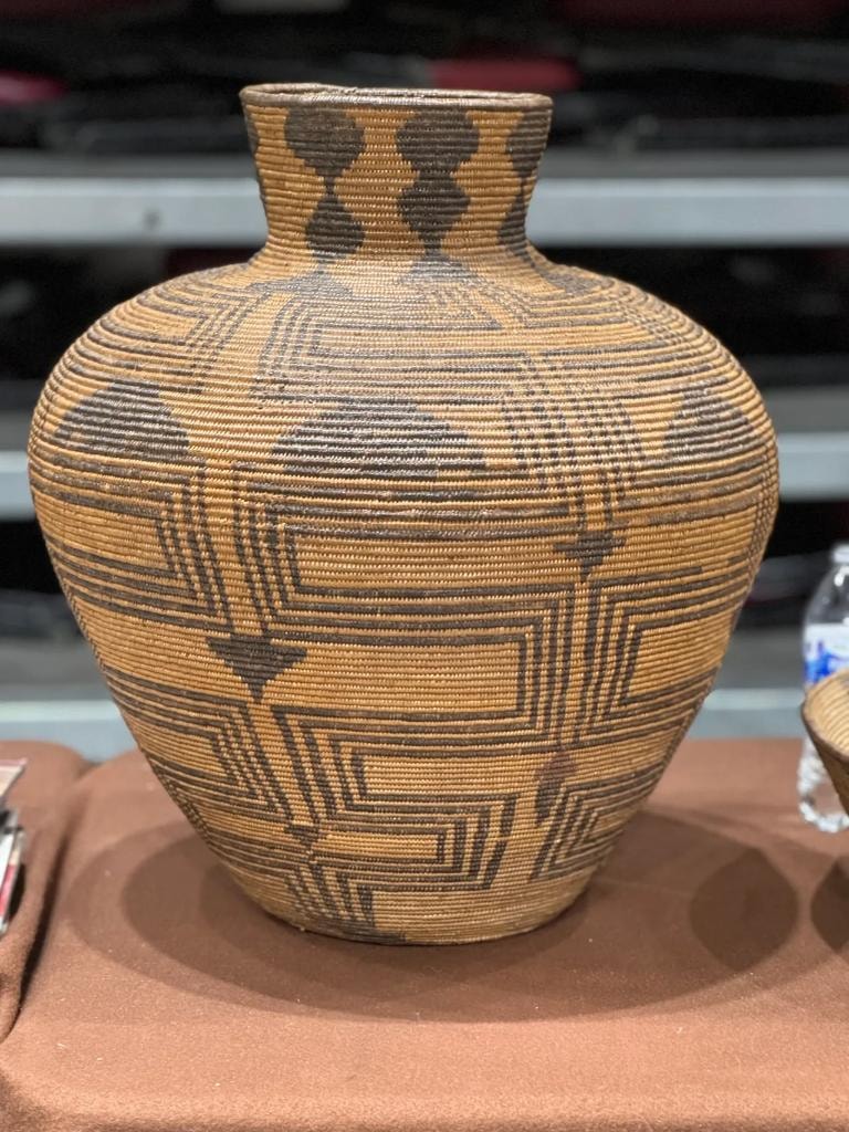 Native American woven basket with geometric patterns