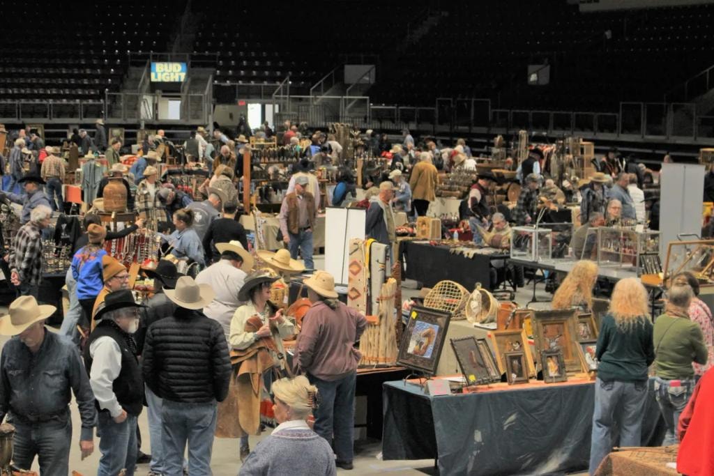 Attendees browsing western collectibles and antiques at CCG