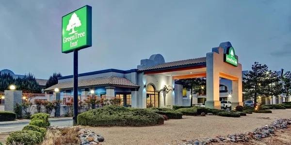 Green Tree Inn exterior at dusk, Prescott Valley AZ — click to visit website